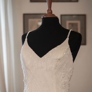 A narrow column or mermaid style lace wedding dress app. size L