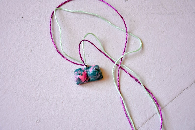 green and prink swirl pattern boob pendant necklace