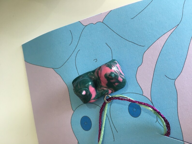 green and prink swirl pattern boob pendant necklace
