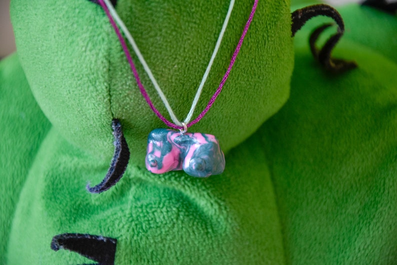 green and prink swirl pattern boob pendant necklace