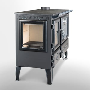 May include: A black cast iron wood-burning stove with a glass door and a side oven. The stove has a decorative design on the top and legs.
