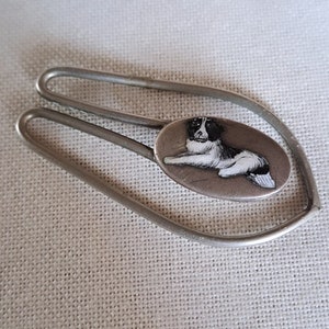Enameled tie clip and/or money clip with a small enameled dog, Art Deco period.