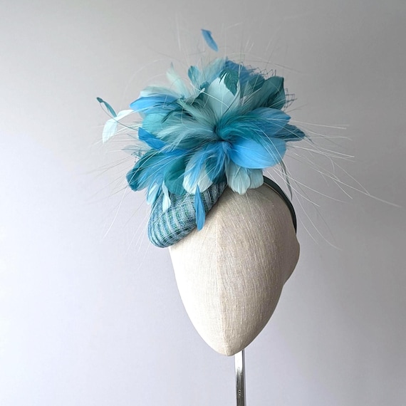 RIO - Blue, green and aqua feathers on multi colored button cocktail hat