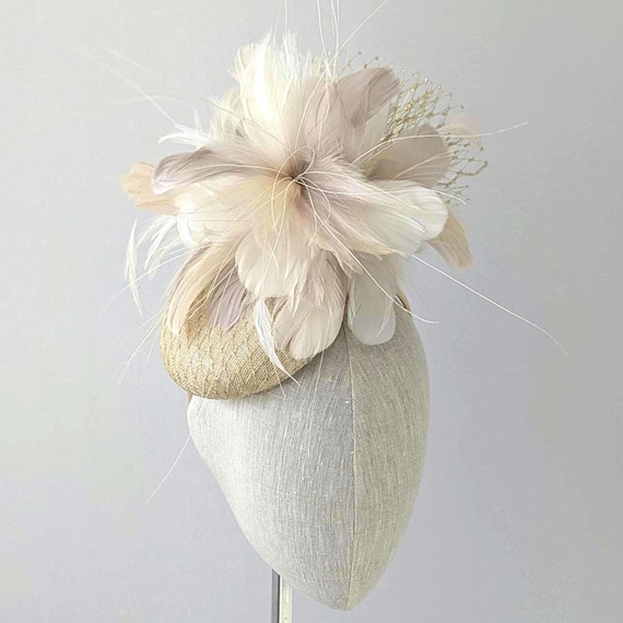 Cocktail Hat in natural straw with gold veiling and gold/beige/ivory feathers