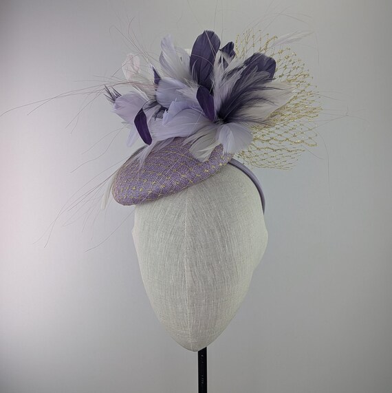 Lilac shades Feather Kentucky Derby Hat. Pillbox style, gold veiling, purple feather fascinator. Bridal shower, tea party or church hat