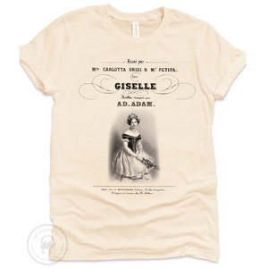 May include: A beige t-shirt with a vintage-style print of a ballerina, the text "Banse par M CARLOTTA GRISI & M. PETIPA. GISELLE Balla. Copyr AD.ADAM." and a small image of a camel.