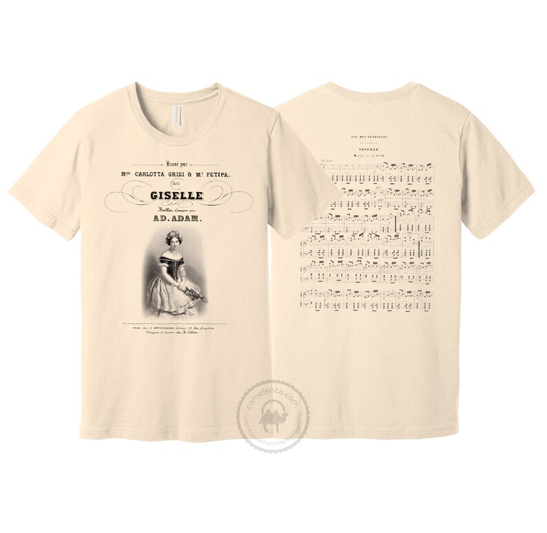May include: A beige t-shirt with a vintage image of a ballerina on the front and sheet music for the ballet "Giselle" on the back. The text on the front reads "Mme. Carlotta Grisi & M. Petipa. Giselle. Ballet compose par A.D. Adam."