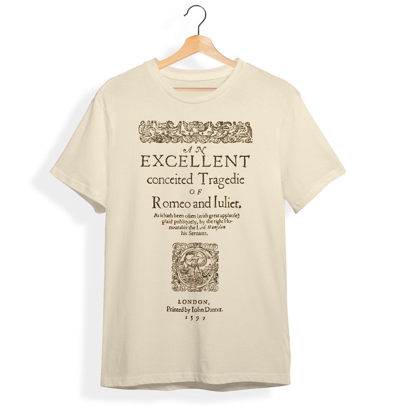 May include: A beige t-shirt with a vintage-style print of the title page of "An Excellent Conceited Tragedie of Romeo and Juliet." The text is in black and the print includes a decorative border and a small illustration. The text reads: "As ithath been often (with great applause) plaid publiquely, by the right Honourable the Lo: Hanjden his Sernants. LONDON, Printed by Lolin Dantet. 1597."