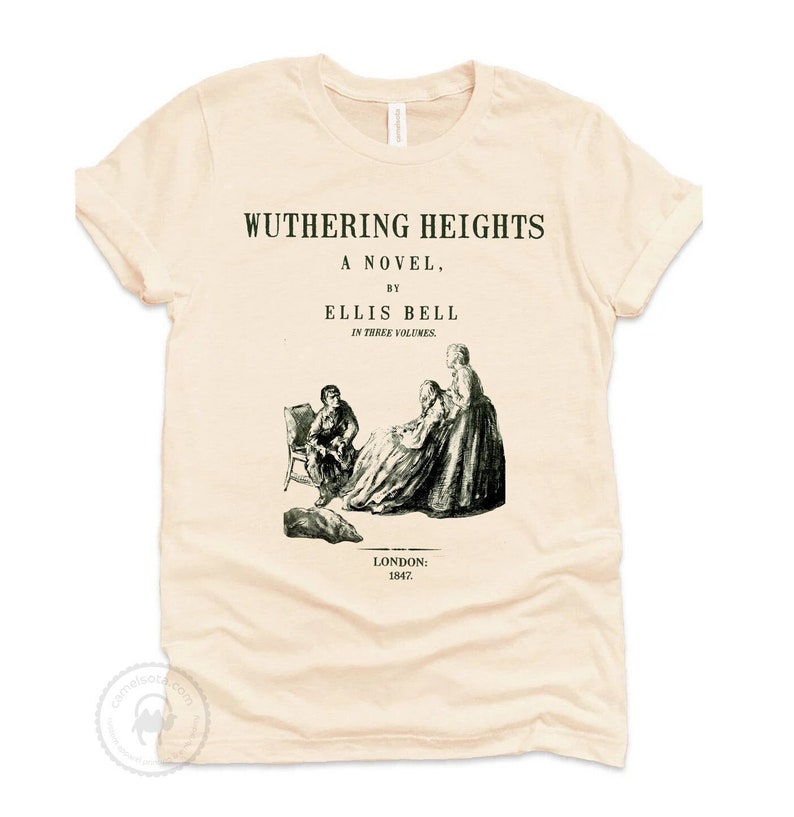 May include: Cream-colored t-shirt featuring the title "WUTHERING HEIGHTS" above a black and white illustration of figures. The text "A NOVEL, BY ELLIS BELL IN THREE VOLUMES" is also printed on the shirt, along with "LONDON: 1847."