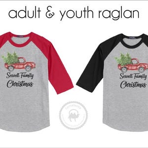 May include: Two raglan shirts with gray bodies and three-quarter sleeves. One has red sleeves, the other black. Each shirt features a red truck carrying a Christmas tree, with the text "Sewell Family Christmas" below.