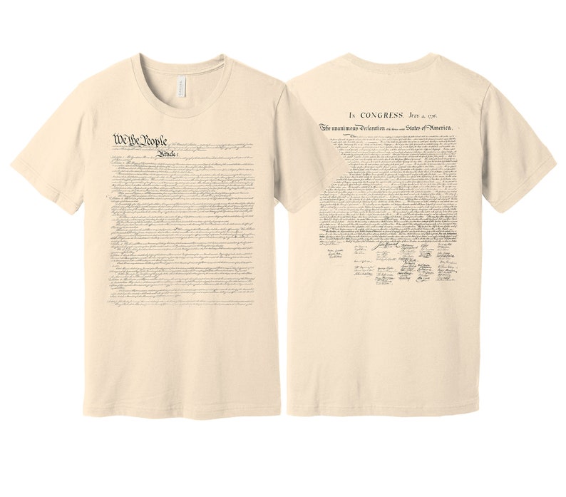 May include: A beige t-shirt with the text "We the People" and the full text of the United States Constitution printed on the front. The back of the shirt features the full text of the Declaration of Independence with the signatures of the signatories.
