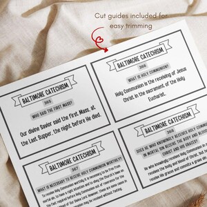 May include: A printed sheet with four sections of text from the Baltimore Catechism. Each section has a title and a question with an answer. The text is in black on a white background. The words "Cut guides included for easy trimming" are at the top.