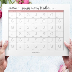 May include: A printable 54-day rosary novena tracker with a pink header and a grid of squares labeled with the letters J, S, and G. The text "rosary novena tracker" is written in cursive.