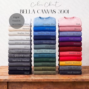 May include: A color chart for Bella Canvas 3901 sweatshirts, displaying three vertical stacks of folded garments in various shades including white, blue, pink, red, green, and black, with text labels identifying each specific color variant.