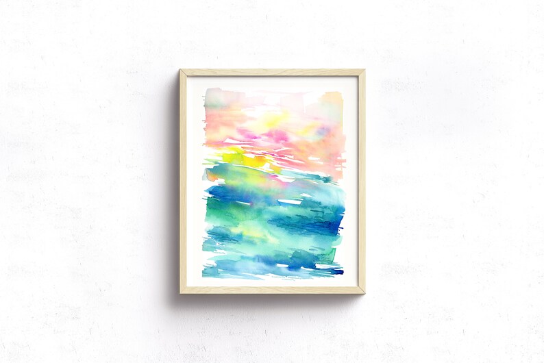 K&ouml;nnte beinhalten: Abstraktes Aquarellbild in einem hellen Holzrahmen. Das Bild zeigt eine Mischung aus rosa, gelben, gr&uuml;nen und blauen Farben in einem geschichteten, Pinselstrich-Stil.