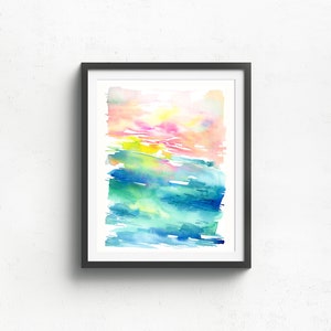 K&ouml;nnte beinhalten: Abstraktes Aquarellbild in einem schwarzen Rahmen. Das Bild zeigt einen farbigen Verlauf von Rosa, Gelb, Gr&uuml;n und Blau.