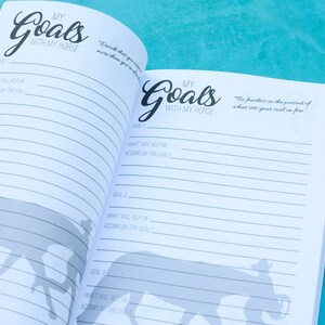 May include: An open notebook with lined pages and the title "My Goals with My Horse" on the cover. The notebook has a silhouette of a horse and rider on each page.