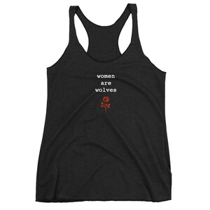 May include: Black racerback tank top with the text "women are wolves" and a red rose graphic.