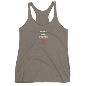 May include: A grey tank top with the text "women are wolves" in white and a red rose graphic.