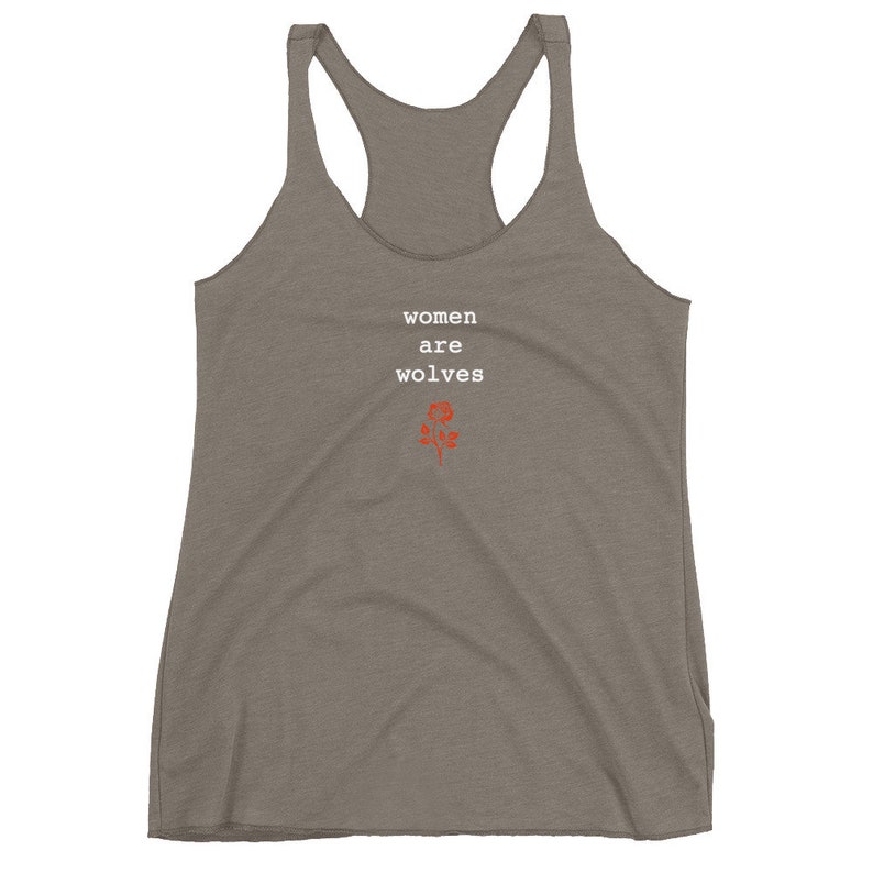 May include: A grey tank top with the text "women are wolves" in white and a red rose graphic.