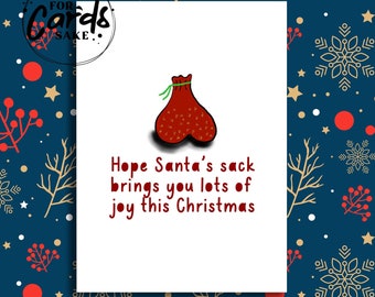 May include: A white Christmas card featuring a red and white illustration of Santa's sack. The text on the card reads "Hope Santa's sack brings you lots of joy this Christmas."