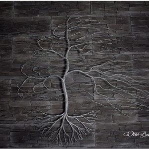 May include: A silver wire bonsai tree sculpture with a thick trunk and many branches, set against a dark gray stone wall background. The sculpture has a realistic look and is a unique piece of art.