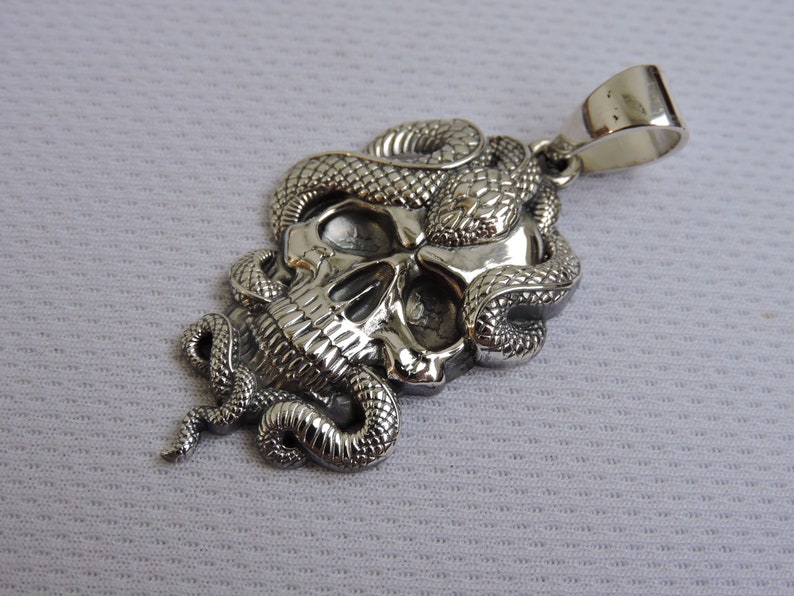 Snake skull pendant