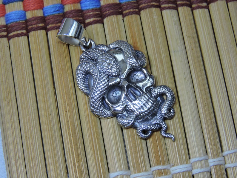 Snake skull pendant