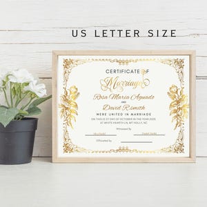 May include: A gold-trimmed white certificate with a gold inscription that reads "Certificate of Marriage" and includes the names "Rosa Maria Aguado" and "David R. Smith". The certificate is decorated with gold floral designs.