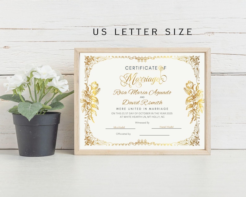 May include: A gold-trimmed white certificate with a gold inscription that reads "Certificate of Marriage" and includes the names "Rosa Maria Aguado" and "David R. Smith". The certificate is decorated with gold floral designs.