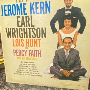May include: Vintage vinyl record album cover titled "A Night With Jerome Kern, Earl Wrightson, Lois Hunt, with Percy Faith and His Orchestra." Features portraits of the performers in black and white.