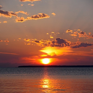 Photograph of vibrant sunset over Green Bay in Door County Wisconsin. Sunset print, sunset photography, sunset shimmer, wall art, wall decor