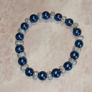 Blue glass Pearl with a Textured Silver Colored Disk Bracelet