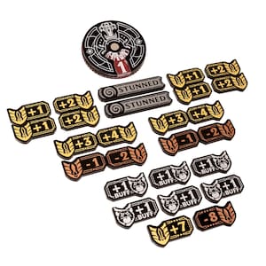 May include: A selection of game tokens and a circular game piece. The tokens display numerical values, the word "BUFF" and "STUNNED". The circular piece has a crown design and the number "1".