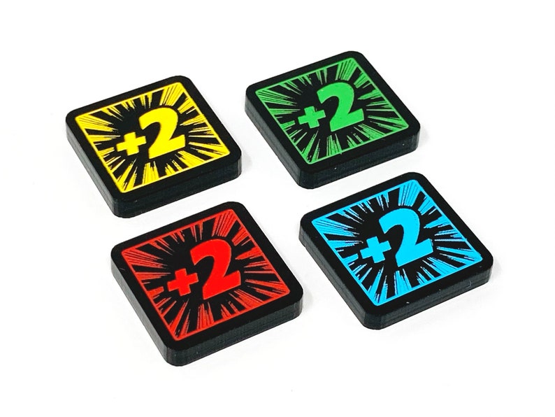 May include: Four square game tiles with black borders and a white starburst design. Each tile has a different coloured background: yellow, green, blue, and red. The number "2" is printed in white on the yellow tile, green on the green tile, blue on the blue tile, and red on the red tile. The text "+2" is printed in black on each tile.