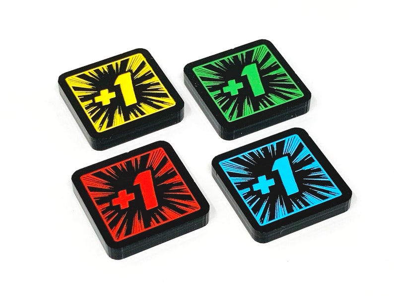 May include: Four square game pieces with black borders and a white starburst design. Each piece has a different coloured background: yellow, green, red, and blue. The centre of each piece has a white " +1" printed on it.