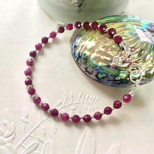 Ruby Bracelet With Heart Charm: Handmade Sterling Silver Birthstone Jewellery.