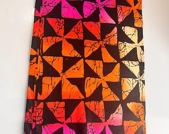 Tela africana estampada Ankara vibrante: algodón naranja, rosa y amarillo, cortada a medida.