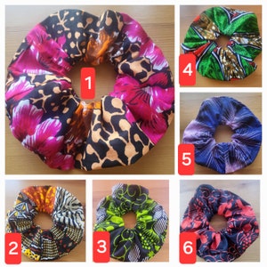 May include: Ten colorful hair scrunchies with different patterns. The scrunchies are made of fabric and have a gathered elastic band. The scrunchies are numbered 1 through 6.