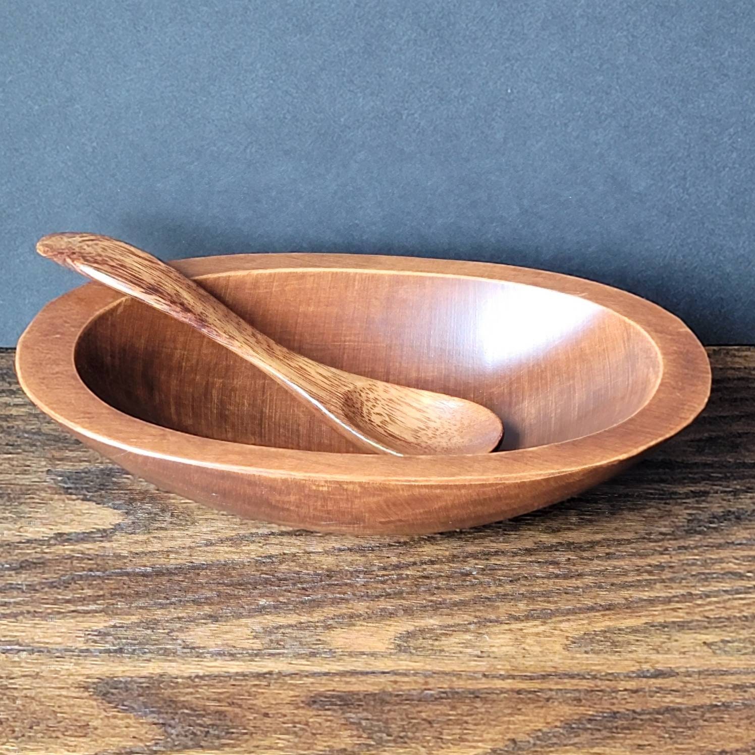 small wooden bowl with wooden baby spoon