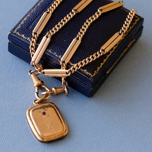 Cadena de reloj doble Albert de caballero eduardiano antiguo con medallón Art Nouveau