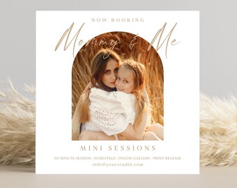 May include: A white square card with the text "Now Booking Mommy & Me Mini Sessions" in gold lettering. The card features a photo of a mother and daughter in a field of tall grass. The text below the photo reads "30 Minute Session, Digitals, Online Gallery, Print Release, info@yourstudio.com."