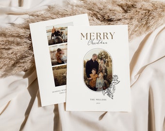 May include: A Christmas card with a photo of a family of five in an oval frame. The card has a floral design and the text "Merry Christmas" and "The Millers 2023".