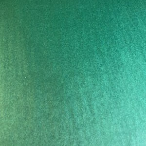 Puede incluir: Una superficie texturizada verde s&oacute;lido con un ligero degradado de verde claro a verde oscuro.