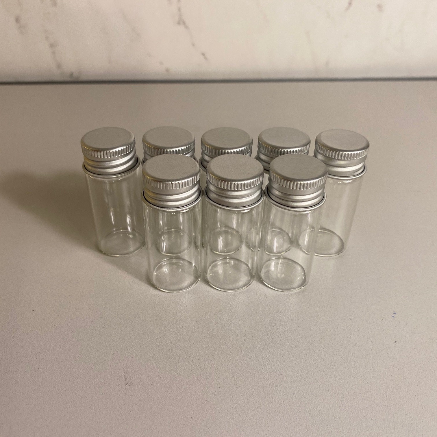 8 pack 10ml Glass Stash Jars with Lids, 10 milliliters (.34 fl oz),…
