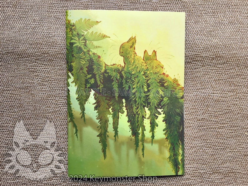 May include: Two green, furry, cat-like creatures sit on a branch covered in green ferns. The background is a soft yellow.
