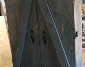 Rustic dartboard cabinet