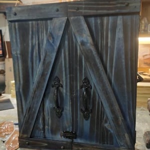 Rustic dartboard cabinet