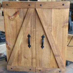 Rustic dartboard cabinet. Indoor/outdoor use