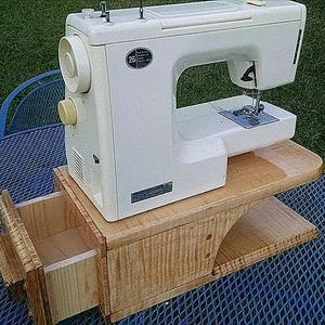 Sewing machine riser